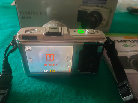 Olympus  Pen EP-12fd306b8-336a-4918-bf00-55052cbefef3