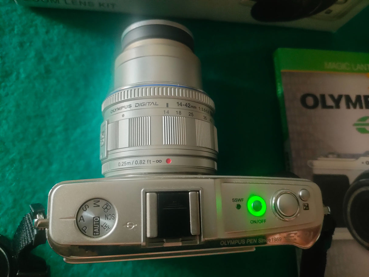 Olympus  Pen EP-12fd306b8-336a-4918-bf00-55052cbefef3